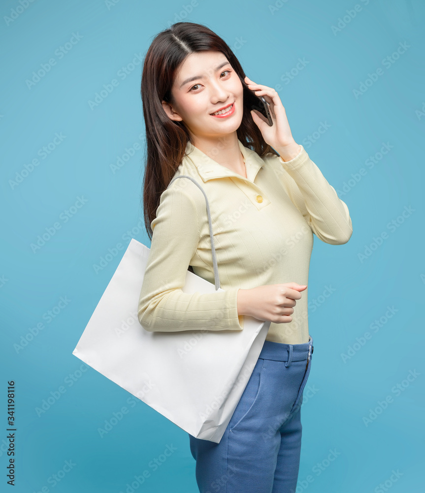 Asian girl on blue background

