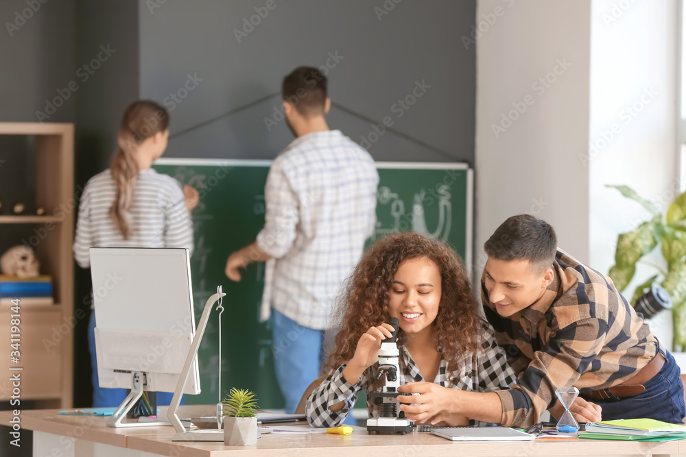 Young people at lesson in classroom