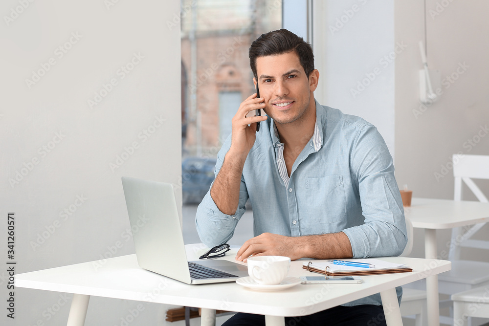 Business owner working in his cafe