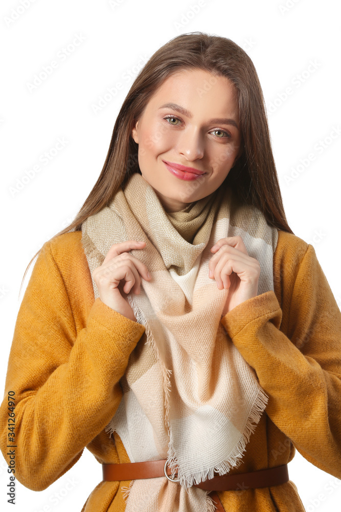 Beautiful young woman with stylish scarf on white background