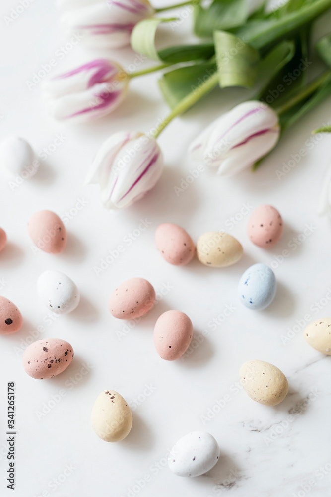 Chocolate Easter eggs and tulips flatlay