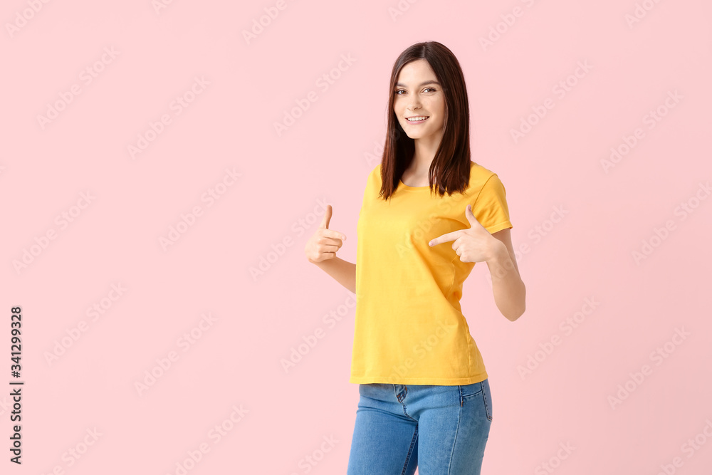 Woman in stylish t-shirt on color background