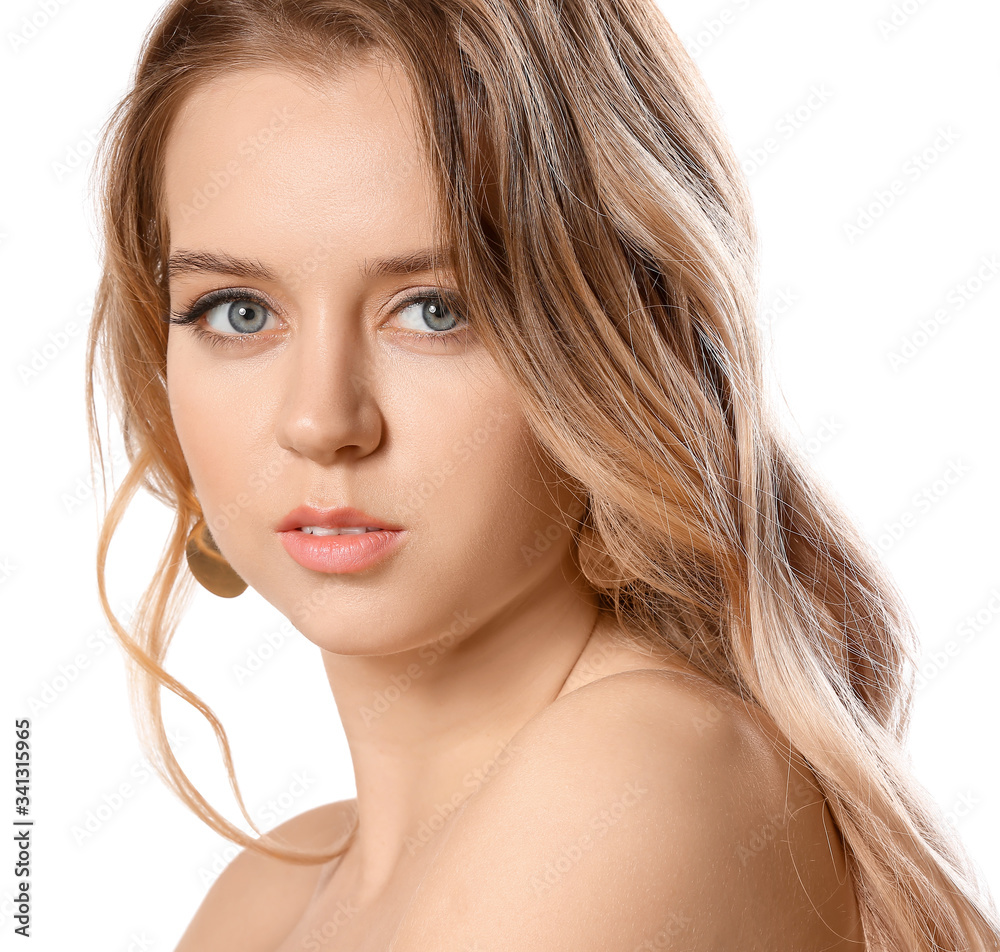 Young blonde with beautiful hair on white background