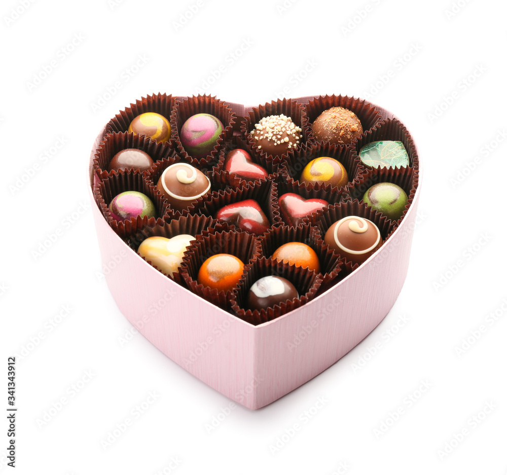 Heart-shaped box with delicious candies on white background