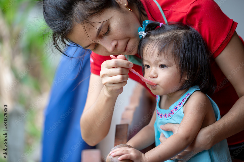 Close up infant baby feeding food