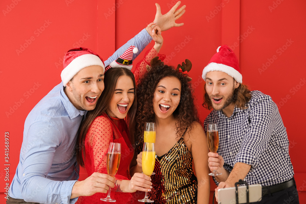 Friends taking selfie at Christmas party