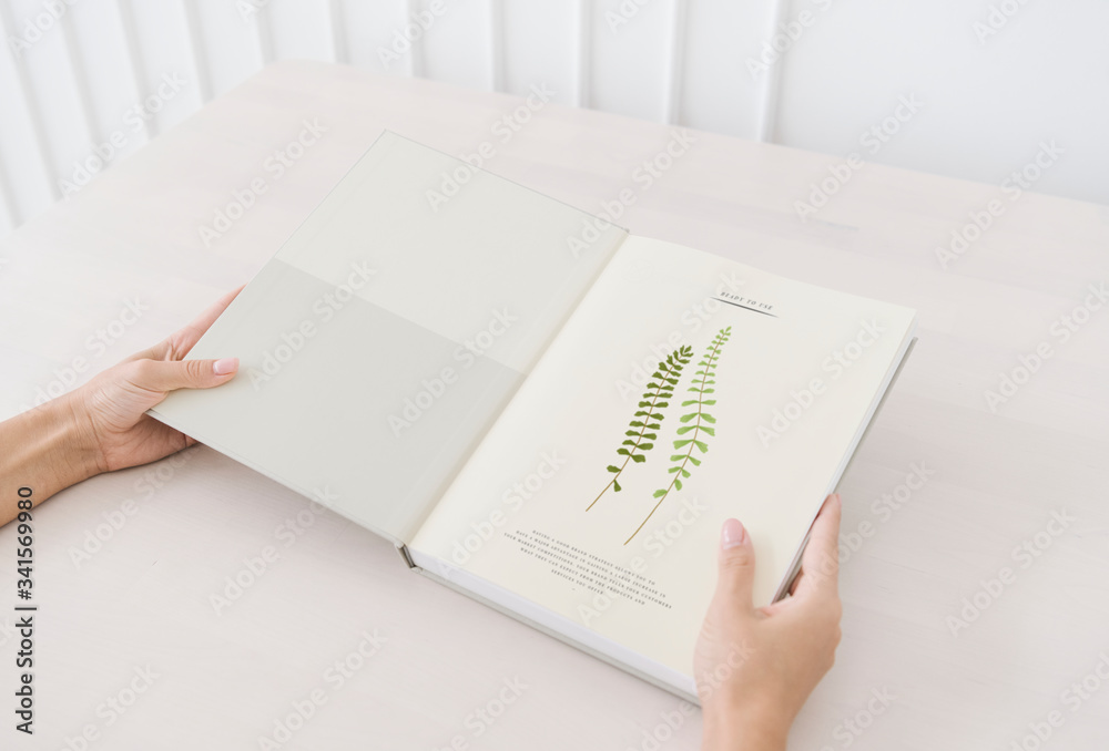 Woman reading a botanical book mockup