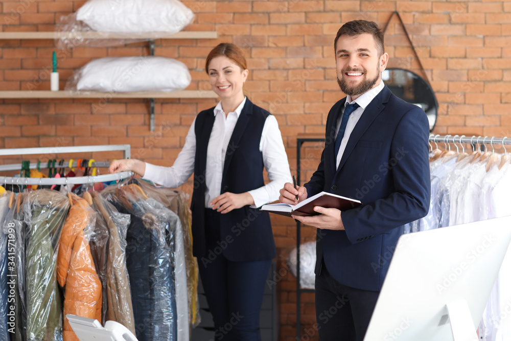 Portrait of workers at modern dry-cleaners