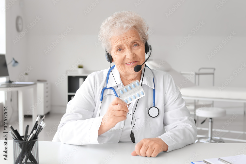 Female doctor giving a consultation online in clinic