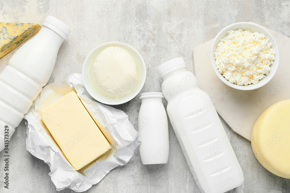 Different dairy products on grey background