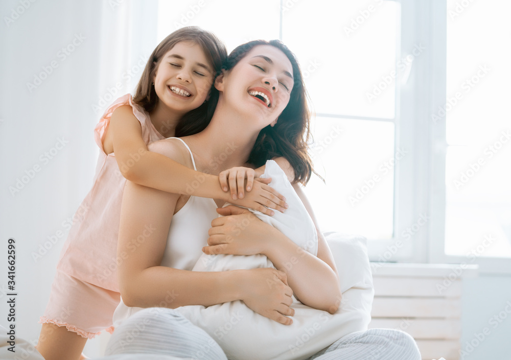 girl and her mother enjoy sunny morning