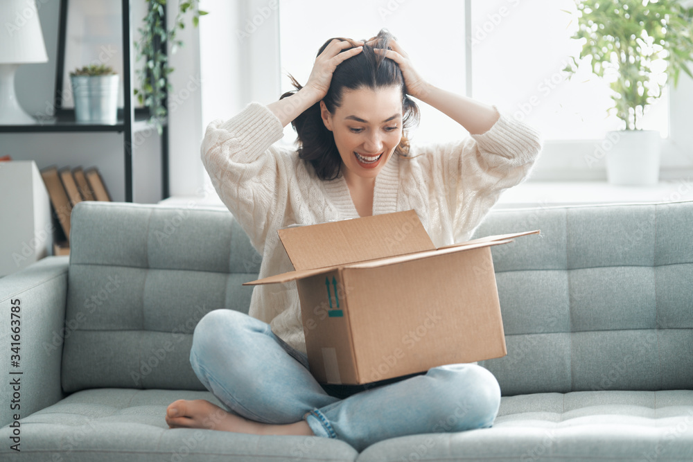 woman is unpacking cardboard