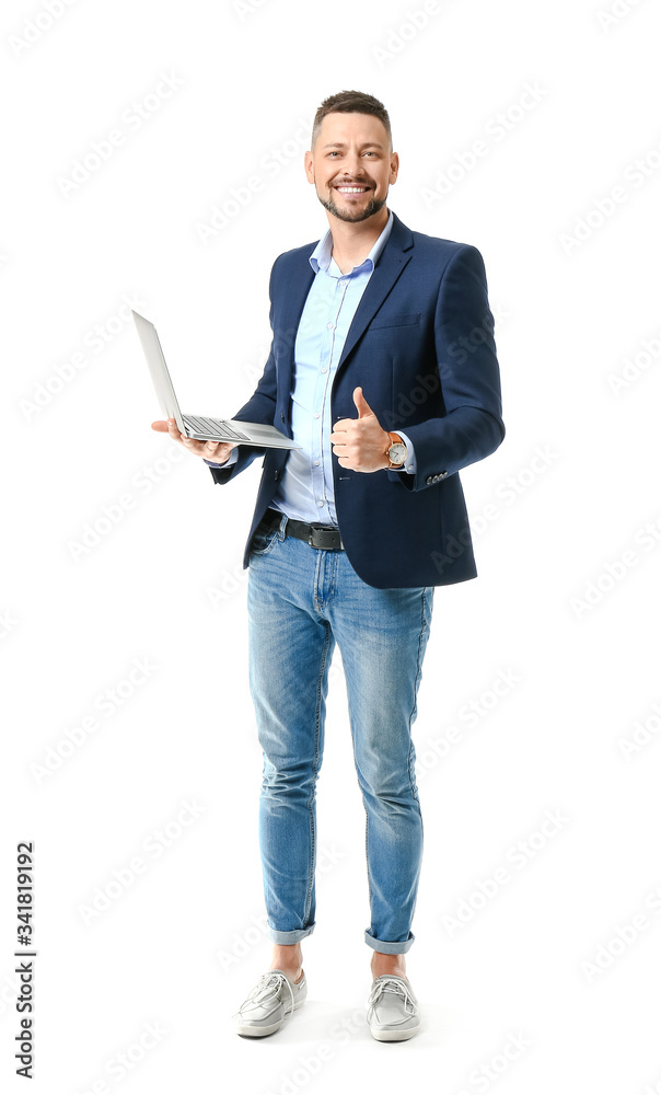 Portrait of handsome businessman with laptop showing thumb-up gesture on white background