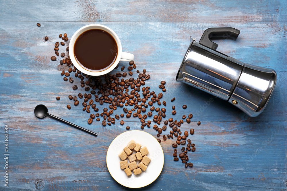 Cup of coffee with sugar and pot on wooden background