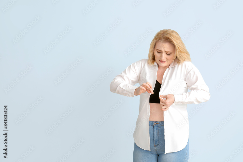 Overweight woman on color background