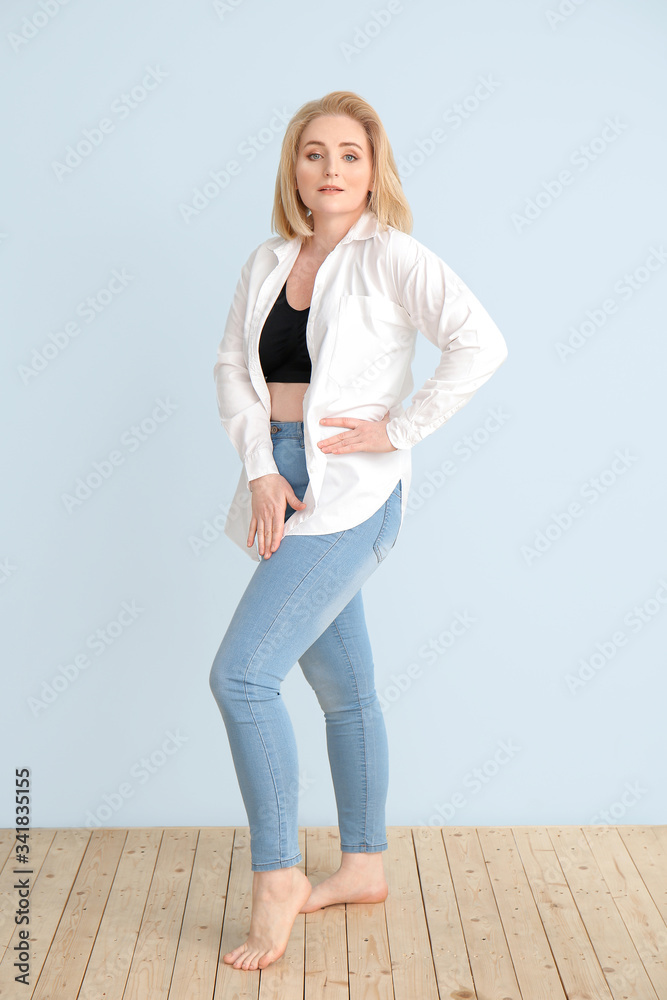 Overweight woman on color background