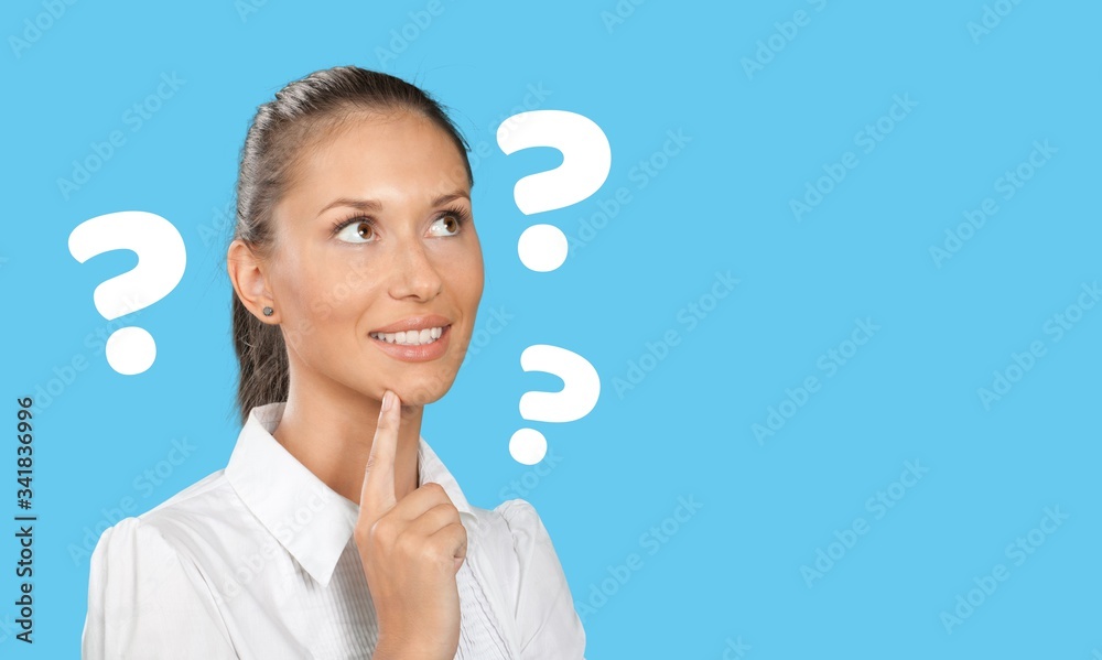 Question sign with a beautiful alarmed woman on pastel background