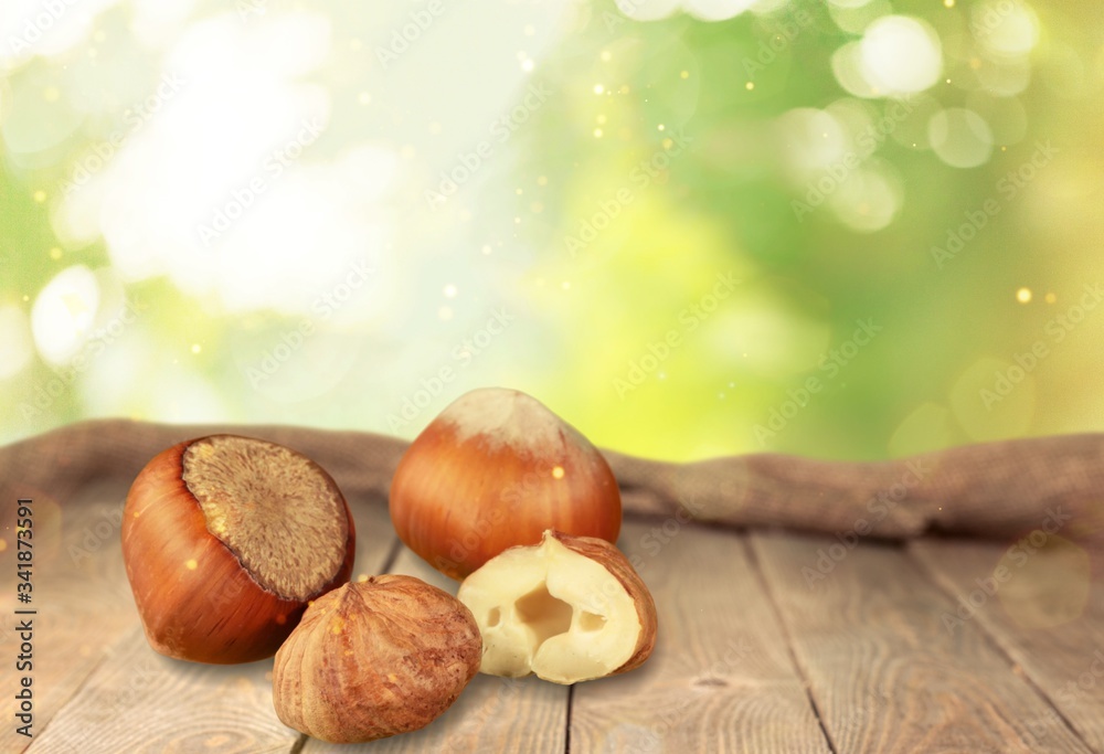 Delicious nuts with seeds on the wooden desk