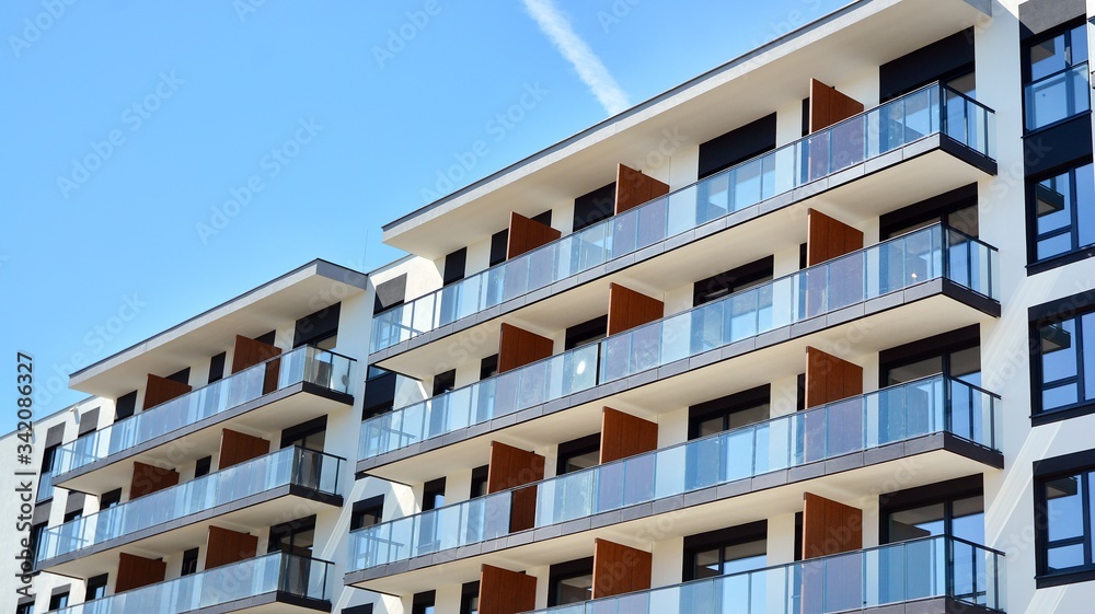 Modern condo building with big windows and modern facade.