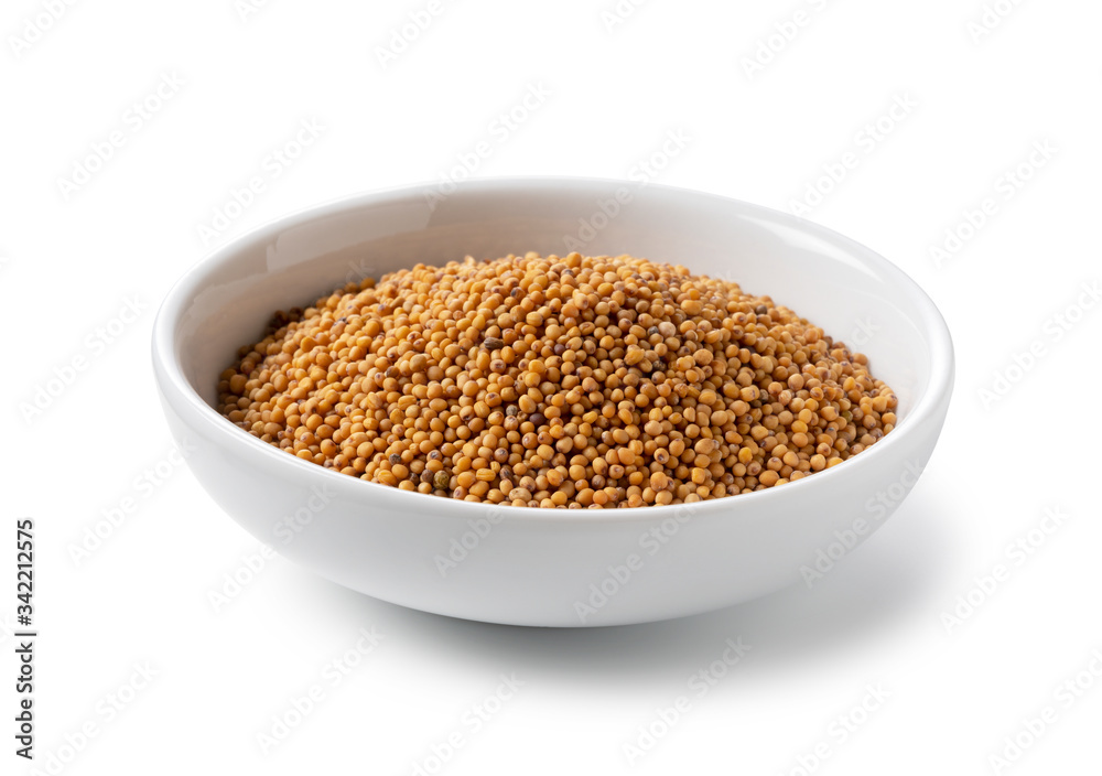 Mustard seeds in a plate placed on a white background