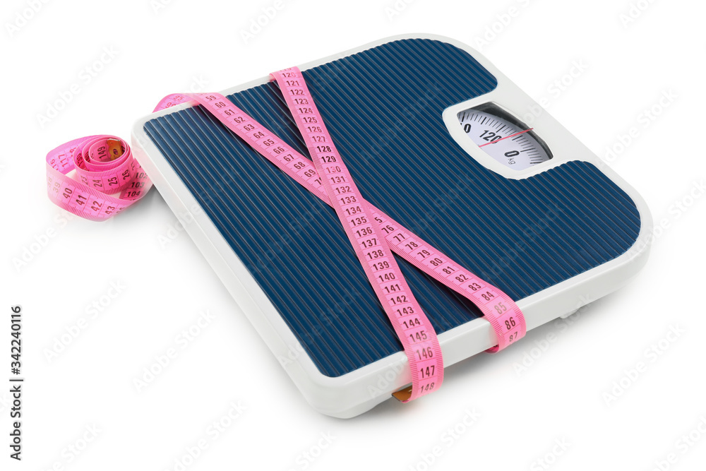 Weight scales with measuring tape on white background. Slimming concept