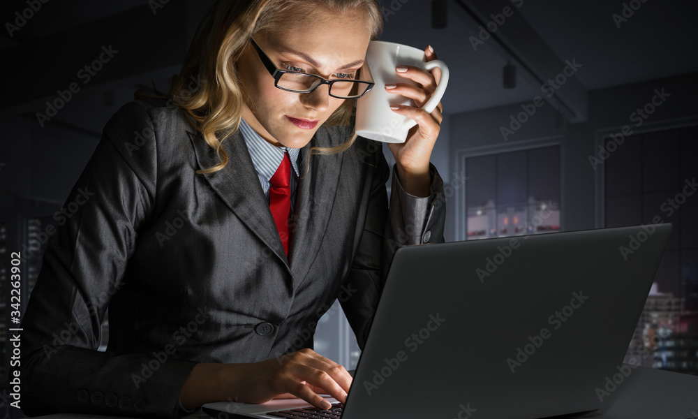 Young businesswoman sitting at desk