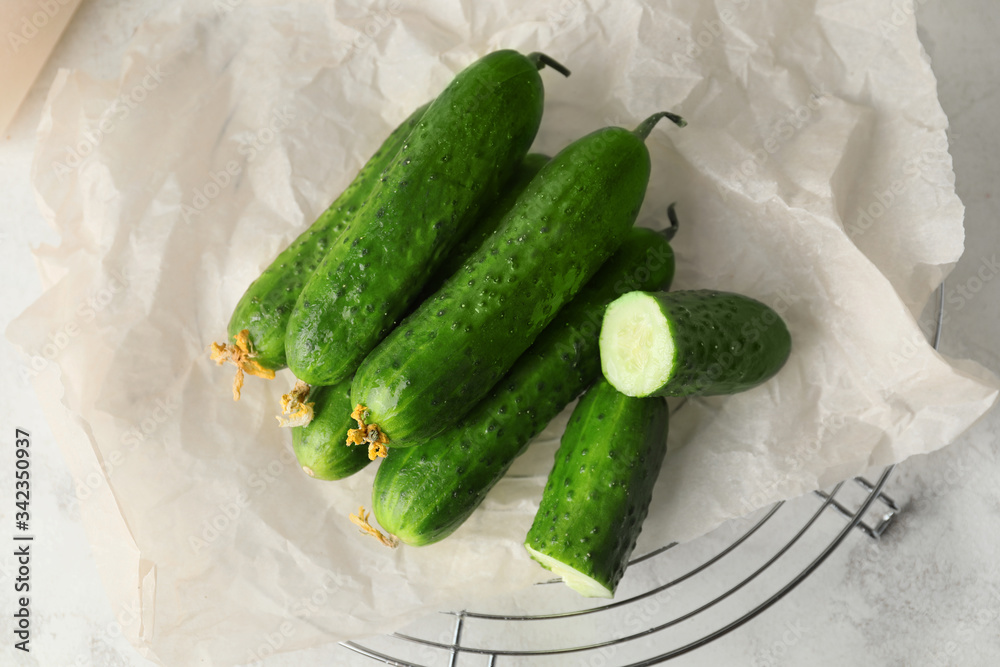 Green cucumbers on white table