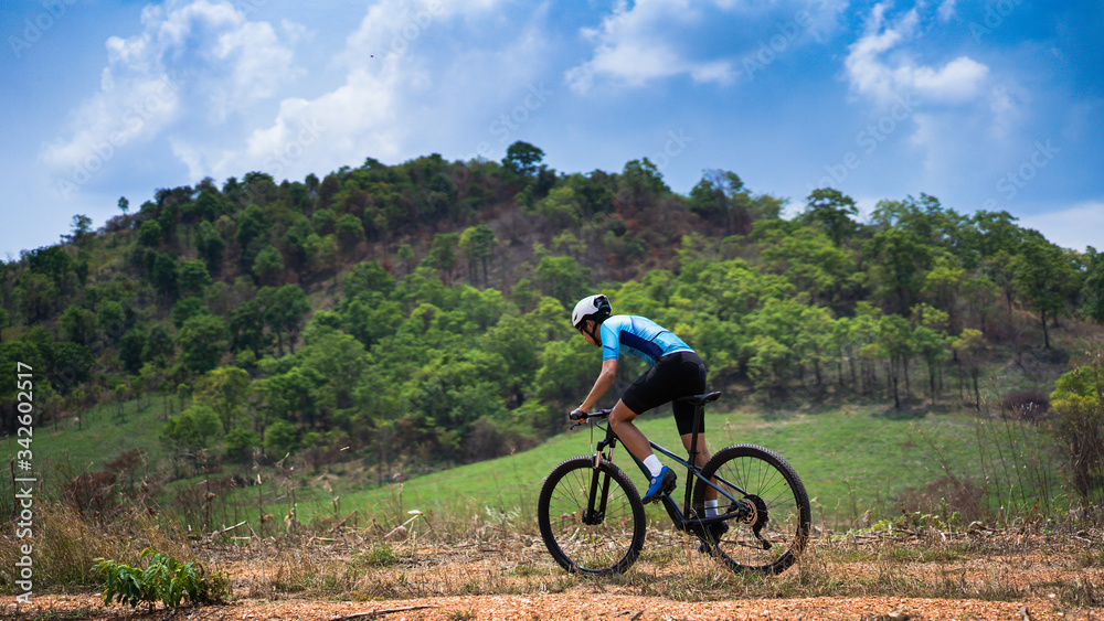 Mountain biker cyclists training Mountain trail