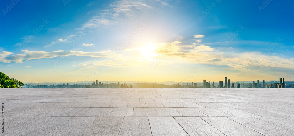 Empty square floor and chongqing city skyline at sunset,China.