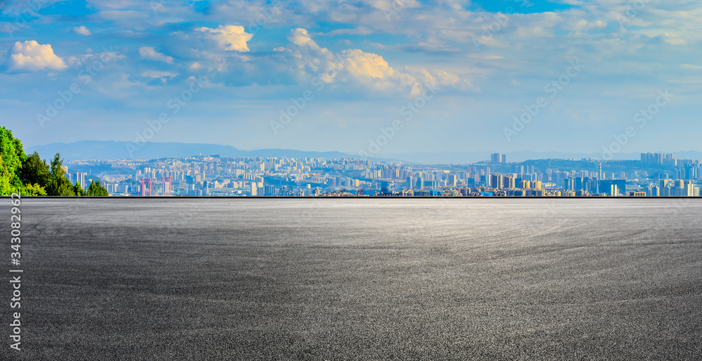 Empty race track and Chongqing city skyline and buildings at sunset,China.