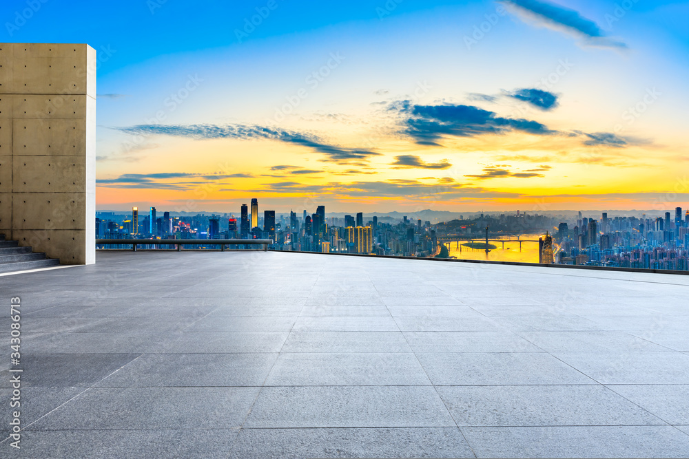 Empty square floor and chongqing city skyline at sunset,China.