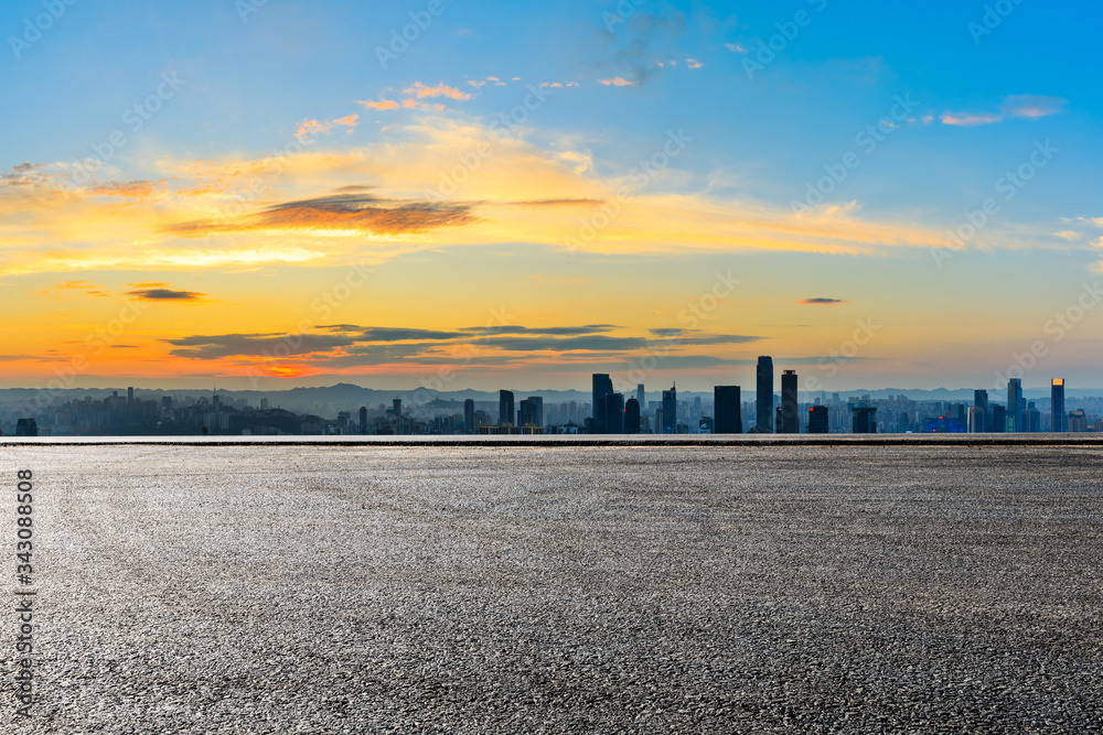 Empty race track and Chongqing city skyline and buildings at sunset,China.