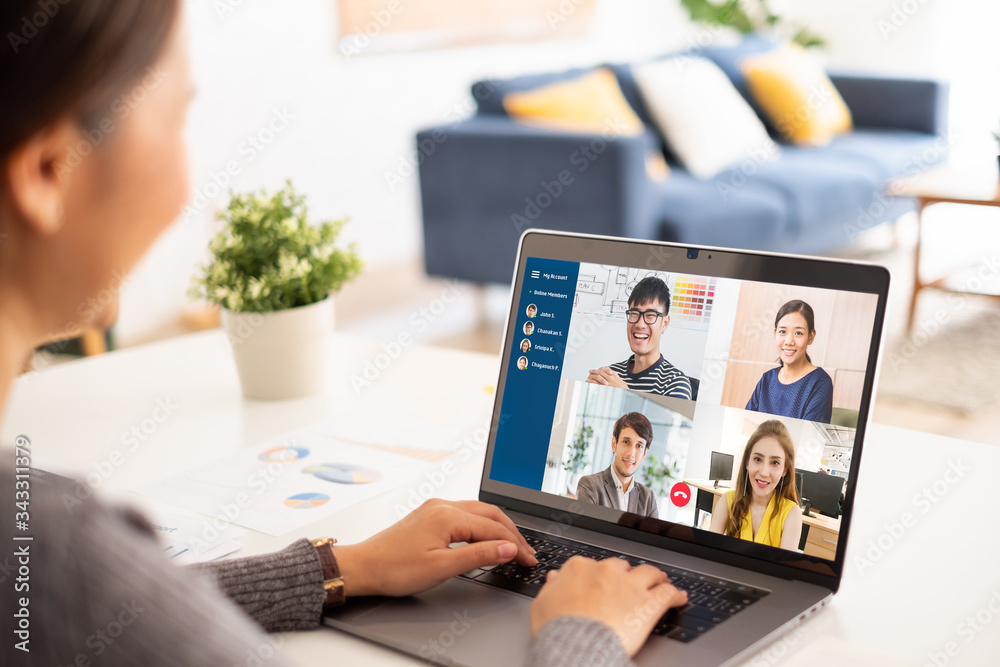 Young Asian businesswoman work at home and virtual video conference meeting with colleagues business