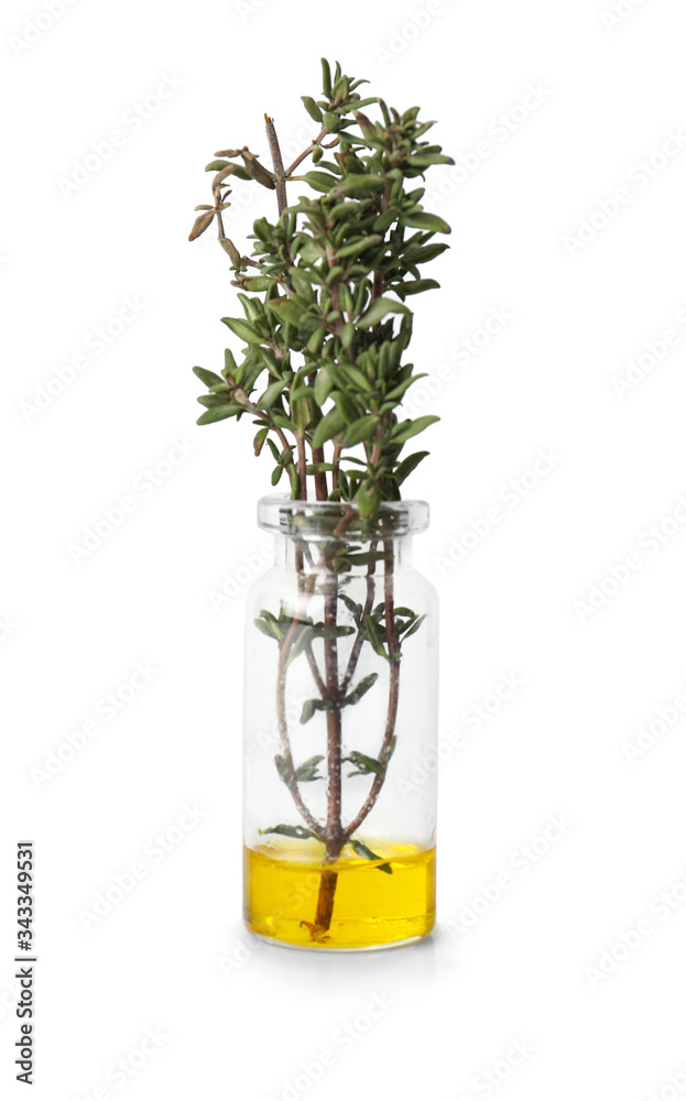 Bottle with thyme essential oil on white background