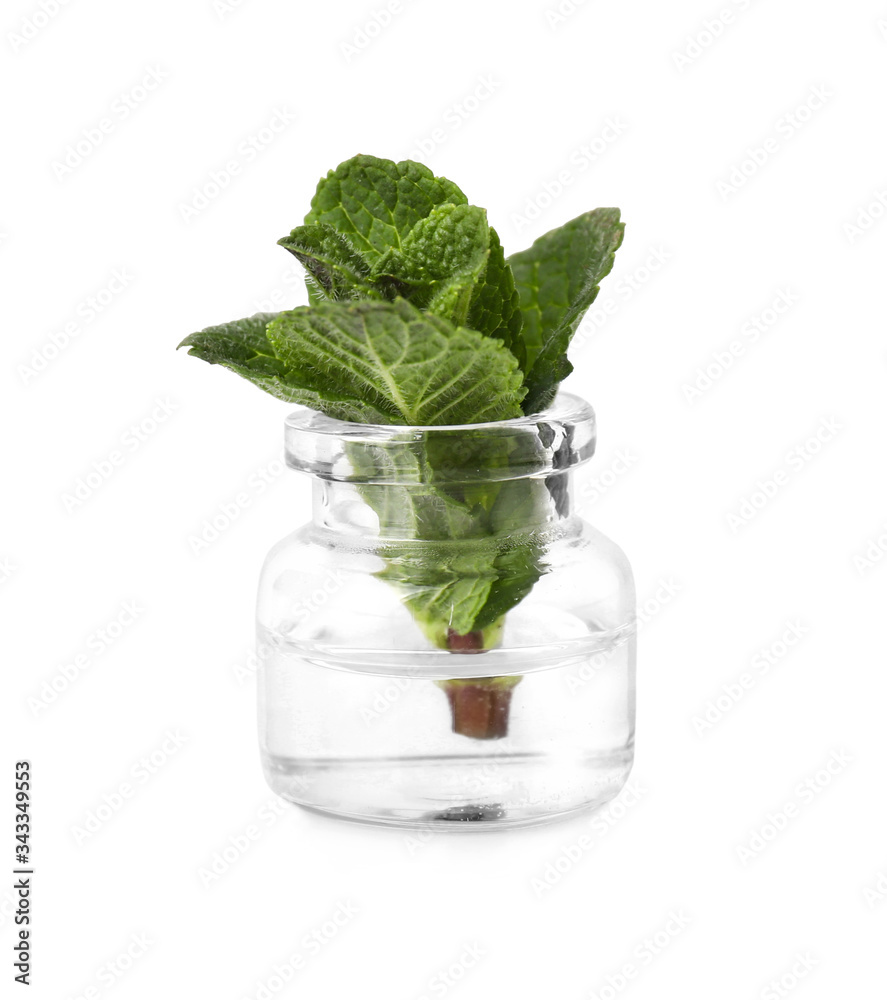 Bottle with mint essential oil on white background