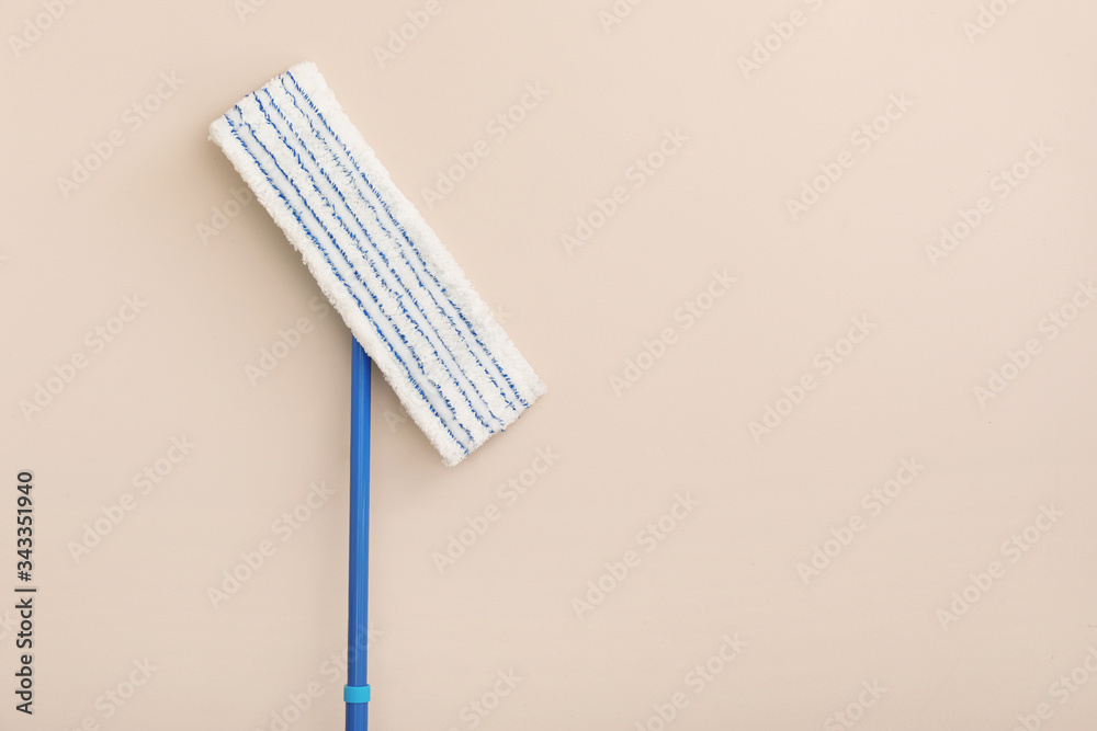 Floor mop on color background