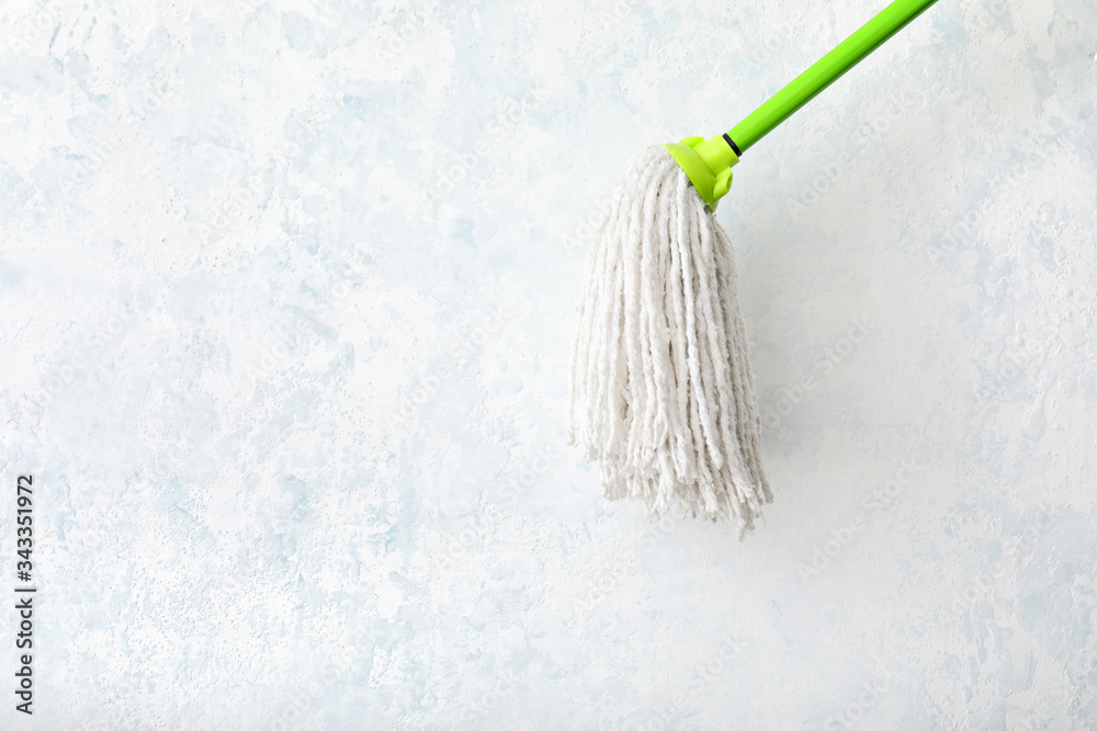 Floor mop on light background