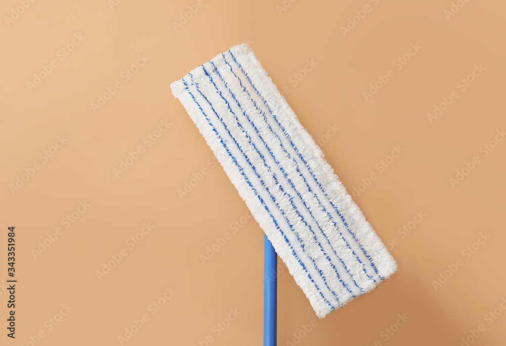 Floor mop on color background