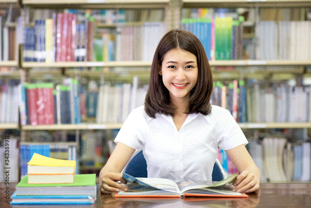 Students studying at table in library