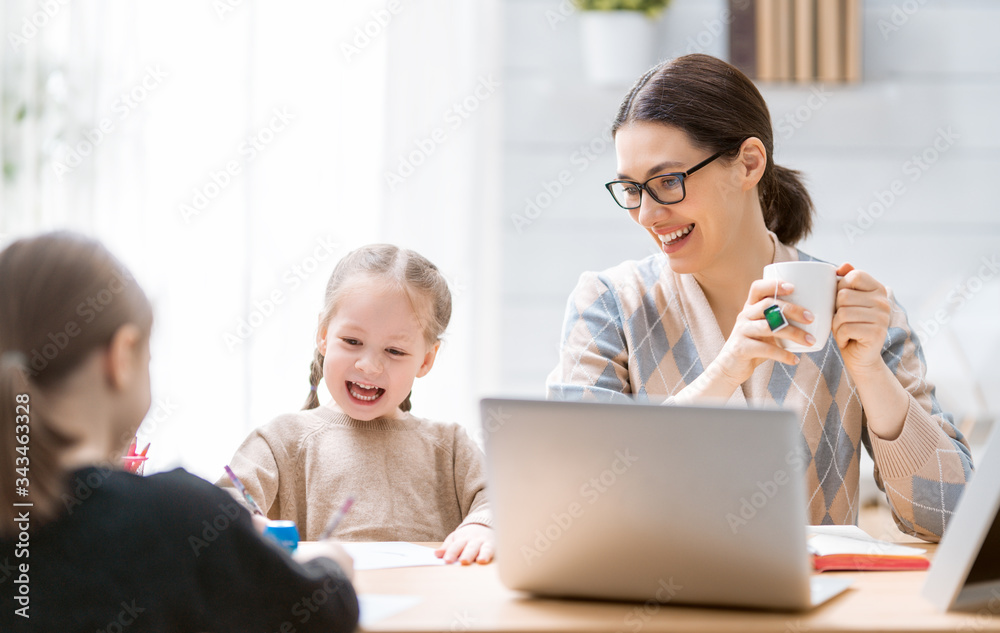 Woman working on a laptop.