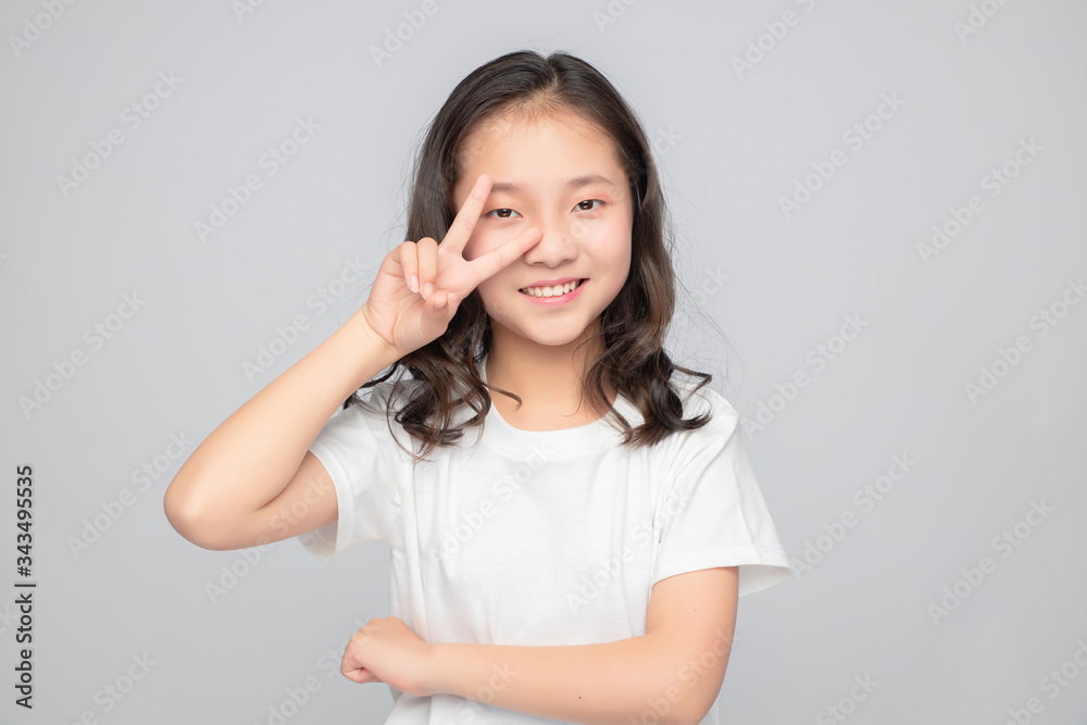 Asian primary school girls in gray background