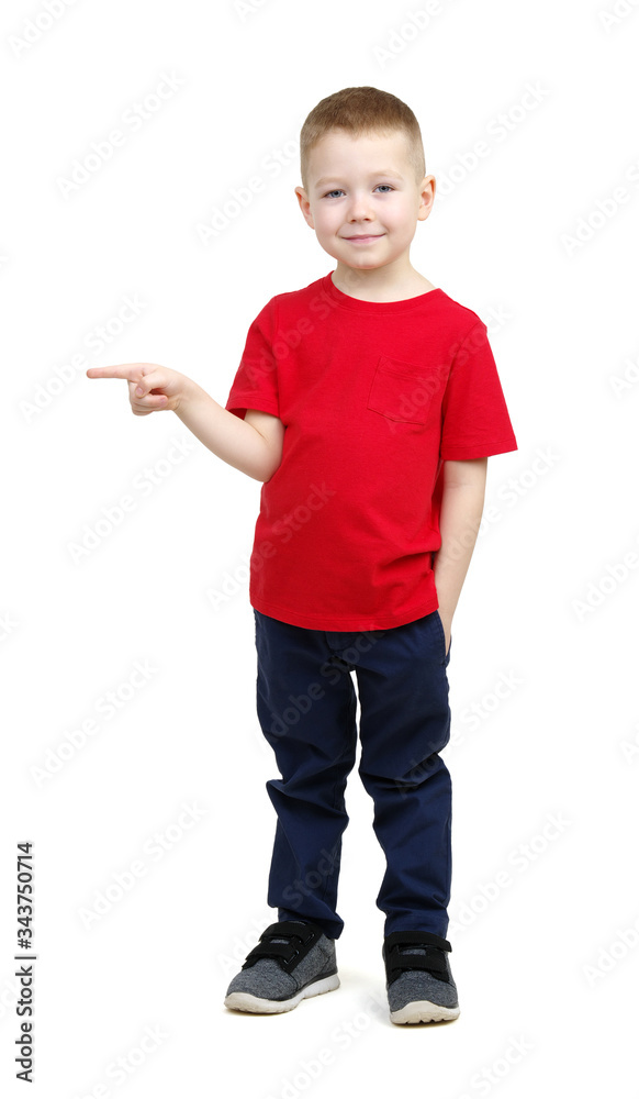  boy in a red t-shirt shows something