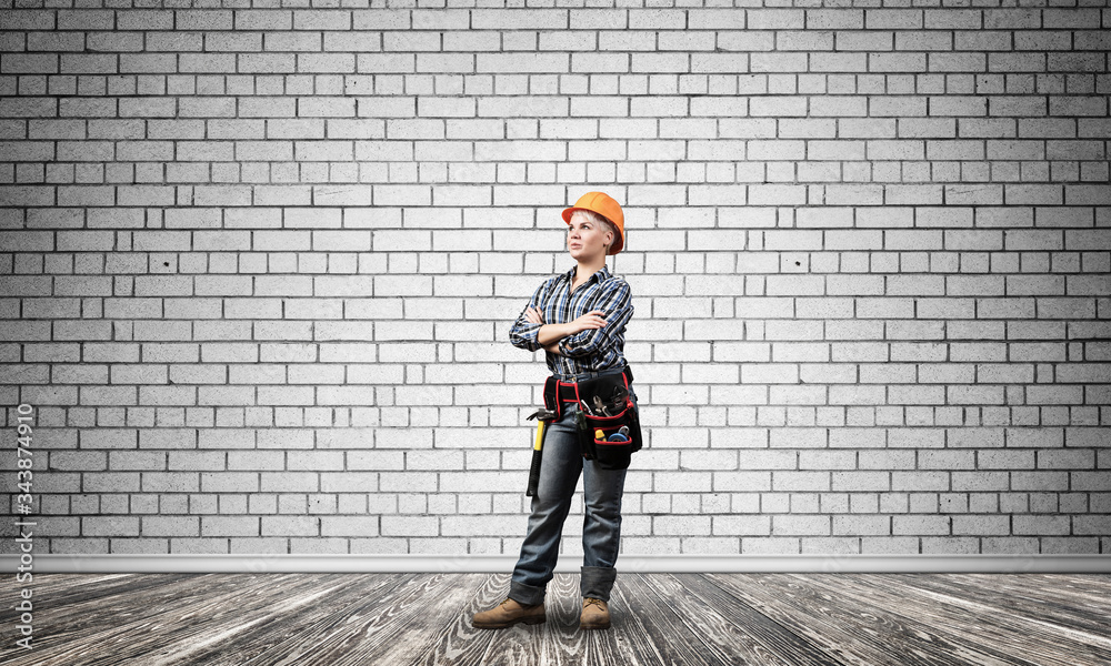 Attractive female engineer in hardhat