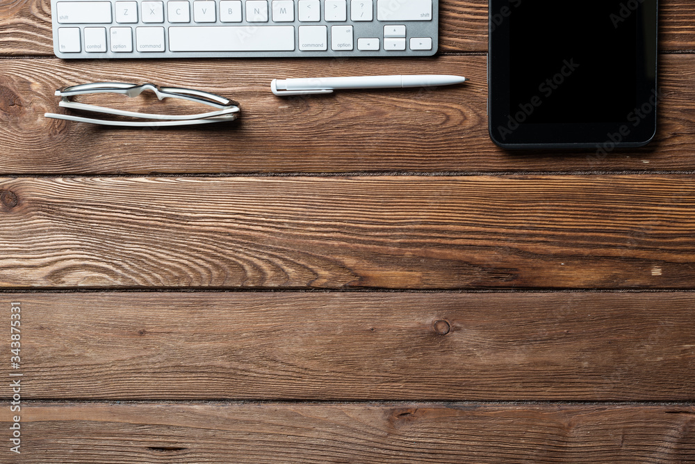 Top view of office workspace with gadgets