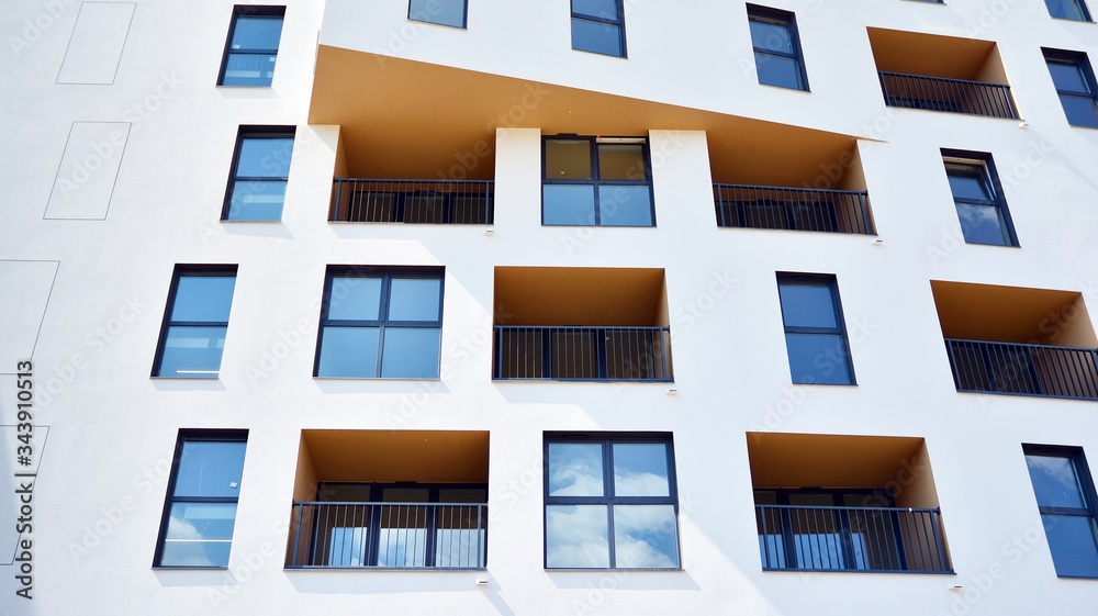 Contemporary residential building exterior in the daylight. Modern apartment buildings on a sunny da