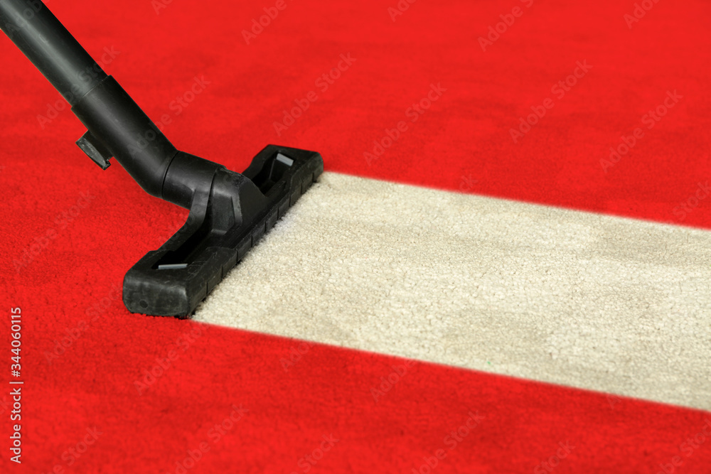 Hoovering of carpet with vacuum cleaner