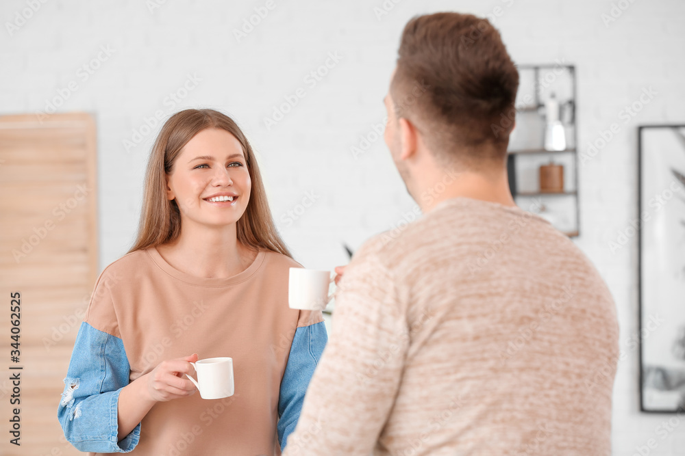 Young couple drinking coffee in cafe