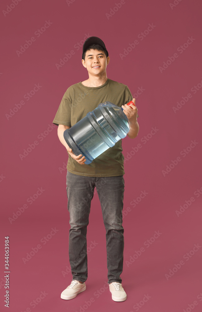 Delivery man with bottle of water on color background