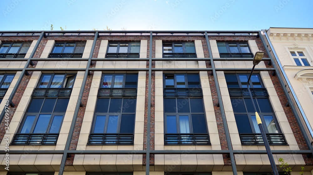 Residential Building on sky background. Facade of a modern housing construction with of balconies.