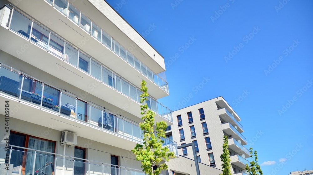 Residential Building on sky background. Facade of a modern housing construction with of balconies.